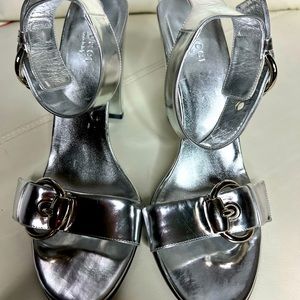 Authentic Gucci Metallic Silver heels with Large Eyelets on Ankle Straps.